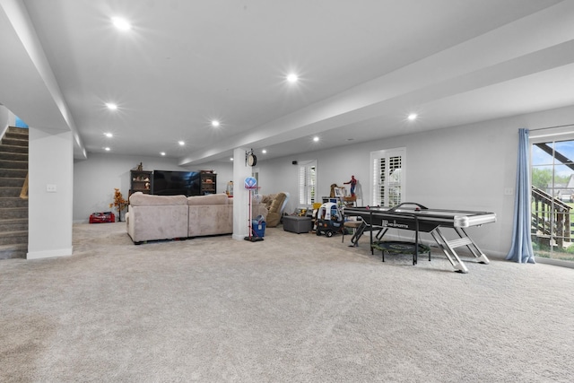 living area with recessed lighting, carpet, baseboards, and stairs