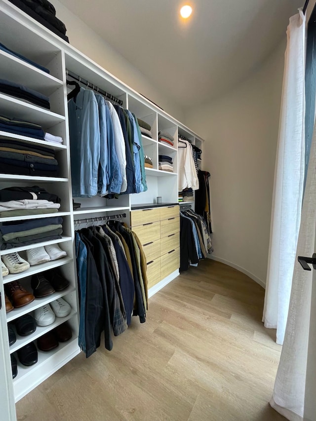 spacious closet with light wood-style floors