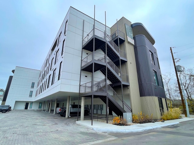 view of building exterior featuring covered parking