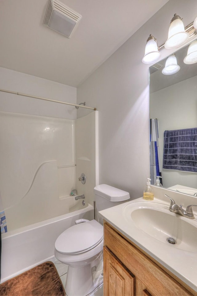 full bathroom featuring visible vents, shower / washtub combination, toilet, vanity, and tile patterned floors
