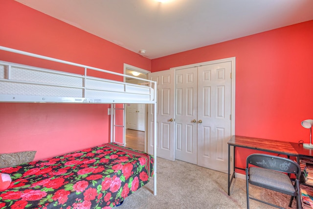 bedroom with a closet and carpet