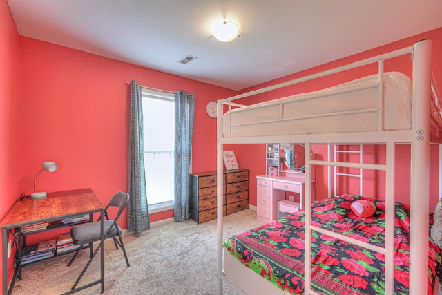 bedroom featuring visible vents, baseboards, and carpet