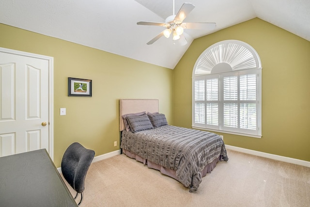bedroom featuring baseboards, vaulted ceiling, a ceiling fan, and carpet floors