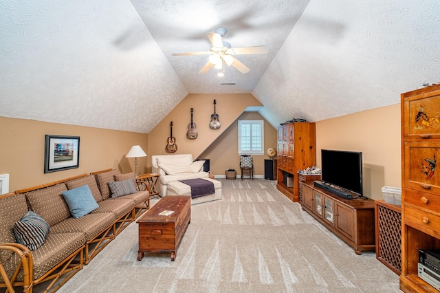 living room with a textured ceiling, ceiling fan, and light carpet
