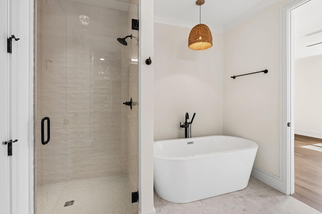917 Kirkwood Ave, Nashville, TN 37204 - bathroom with a stall shower, a soaking tub, crown molding, and baseboards