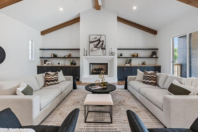 917 Kirkwood Ave, Nashville, TN 37204 - living room featuring beamed ceiling, light wood-type flooring, a fireplace with raised hearth, and recessed lighting