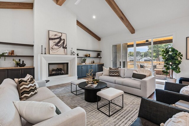 917 Kirkwood Ave, Nashville, TN 37204 - living room with high vaulted ceiling, beamed ceiling, a fireplace with raised hearth, recessed lighting, and wood finished floors