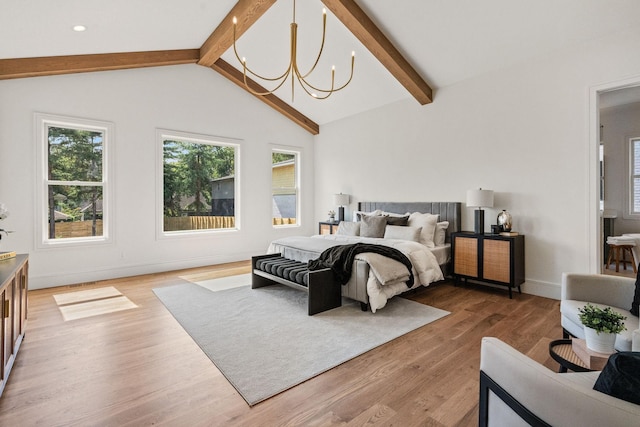 917 Kirkwood Ave, Nashville, TN 37204 - bedroom with light wood finished floors, a notable chandelier, baseboards, and lofted ceiling with beams