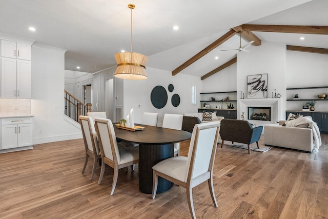 917 Kirkwood Ave, Nashville, TN 37204 - dining area featuring light wood-style floors, a ceiling fan, recessed lighting, stairs, and beam ceiling