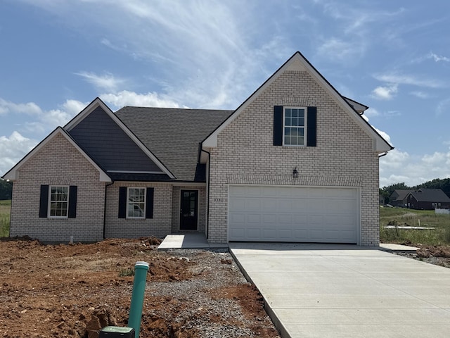 3330 Curie Cir, Christiana, TN 37037 - traditional home featuring concrete driveway, brick siding, and an attached garage