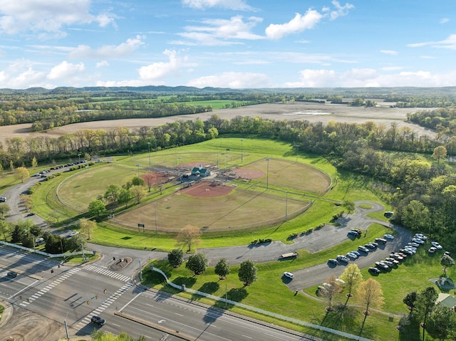 birds eye view of property with a rural view