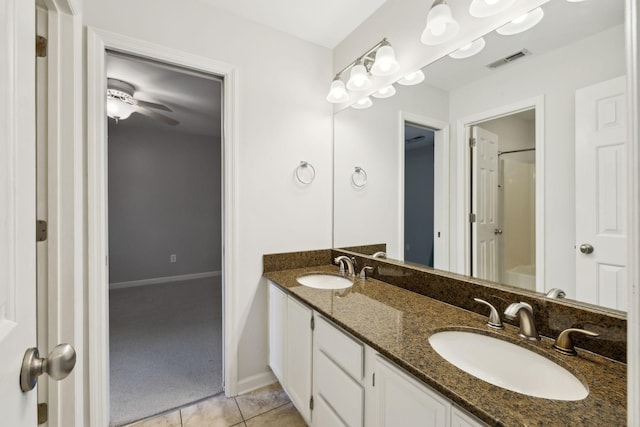 full bathroom featuring tile patterned floors, double vanity, a sink, and visible vents