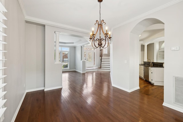 unfurnished dining area featuring built in features, dark wood-style flooring, visible vents, and a sink
