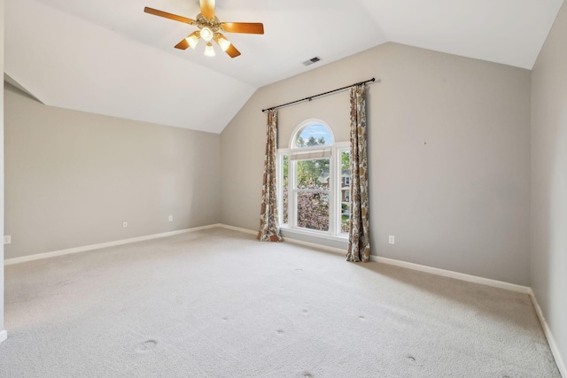 additional living space featuring visible vents, baseboards, ceiling fan, vaulted ceiling, and carpet flooring