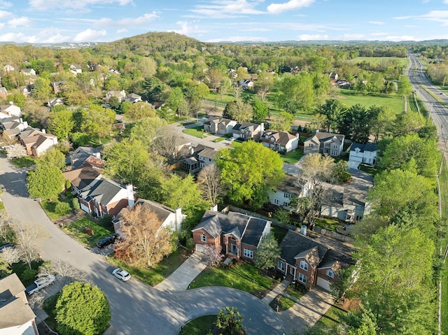 birds eye view of property featuring a residential view and a forest view