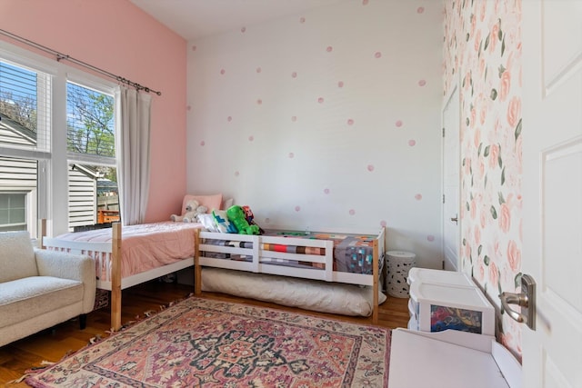 bedroom featuring wood finished floors