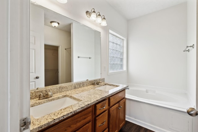 213 Nashua Ct, Murfreesboro, TN 37128 - full bathroom with a garden tub, wood finished floors, a sink, and double vanity