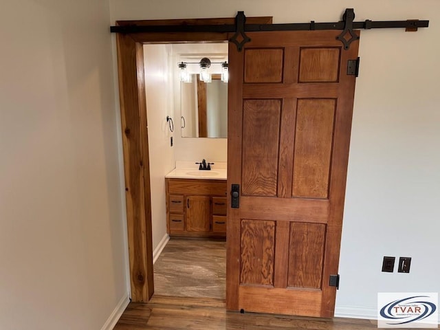 5380 Sulphur Creek Rd, Big Sandy, TN 38221 - bathroom featuring baseboards, vanity, and wood finished floors