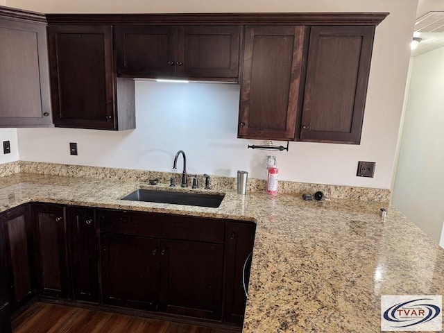 5380 Sulphur Creek Rd, Big Sandy, TN 38221 - kitchen featuring a sink, dark brown cabinets, light stone counters, and dark wood finished floors