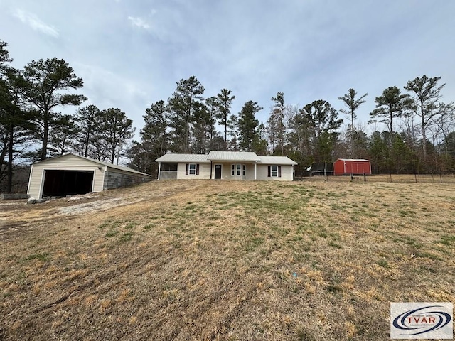 5380 Sulphur Creek Rd, Big Sandy, TN 38221 - view of front of home with an outbuilding, a garage, and a front yard