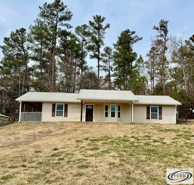 5380 Sulphur Creek Rd, Big Sandy, TN 38221 - single story home with metal roof and a front yard