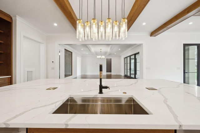 521 Mansion Dr, Brentwood, TN 37027 - kitchen featuring beamed ceiling, open floor plan, a sink, and an inviting chandelier