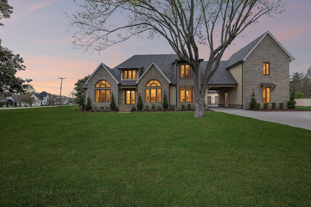 521 Mansion Dr, Brentwood, TN 37027 - view of front of home with a front lawn, stone siding, and concrete driveway