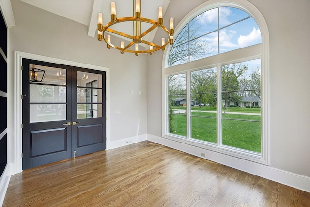521 Mansion Dr, Brentwood, TN 37027 - interior space with baseboards, a chandelier, wood finished floors, french doors, and high vaulted ceiling