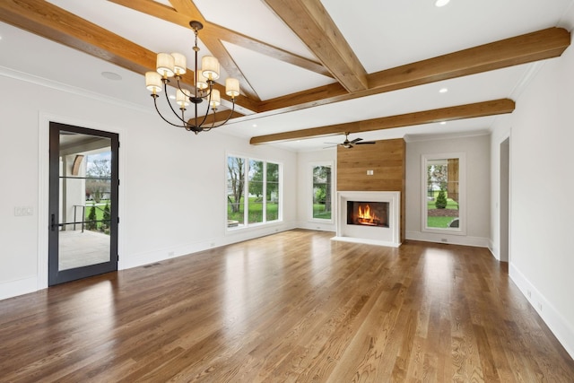 521 Mansion Dr, Brentwood, TN 37027 - unfurnished living room with a warm lit fireplace, baseboards, beam ceiling, and wood finished floors