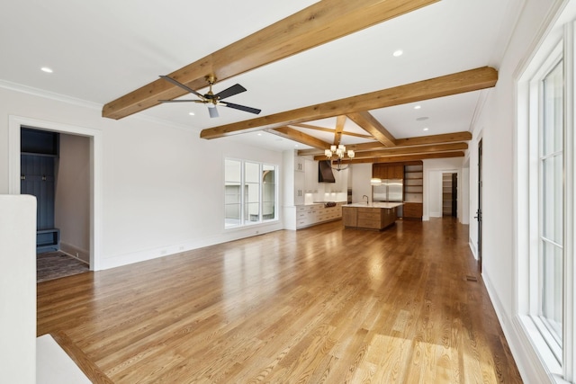521 Mansion Dr, Brentwood, TN 37027 - unfurnished living room with ceiling fan with notable chandelier, light wood-style flooring, baseboards, and beam ceiling