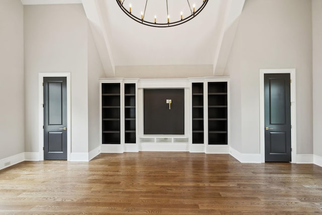 521 Mansion Dr, Brentwood, TN 37027 - unfurnished living room featuring a chandelier, high vaulted ceiling, baseboards, and wood finished floors