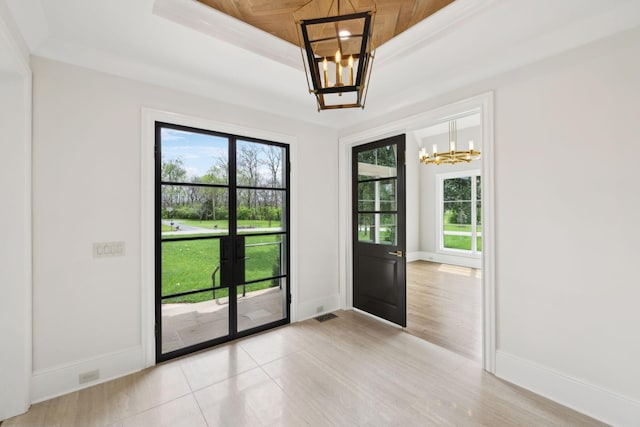 521 Mansion Dr, Brentwood, TN 37027 - doorway to outside with baseboards, a raised ceiling, a notable chandelier, crown molding, and french doors