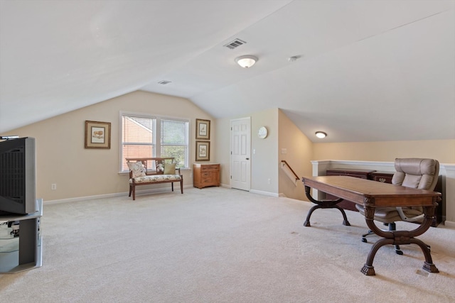 home office with light carpet, visible vents, baseboards, and lofted ceiling