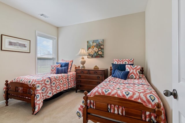bedroom featuring visible vents and carpet