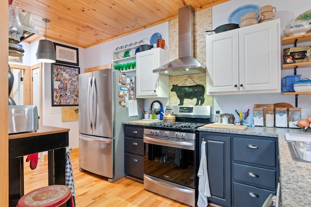 1720 Bratton Ln, Williamsport, TN 38487 - kitchen with stainless steel appliances, white cabinets, open shelves, and wall chimney range hood