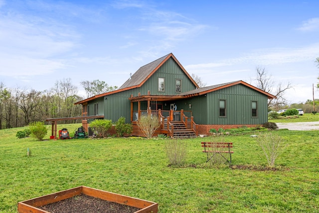 1720 Bratton Ln, Williamsport, TN 38487 - back of house featuring a yard and a vegetable garden
