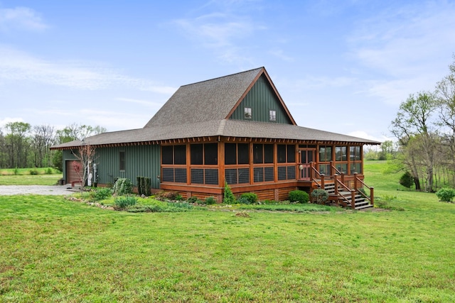 1720 Bratton Ln, Williamsport, TN 38487 - rear view of property featuring gravel driveway, roof with shingles, board and batten siding, and a sunroom