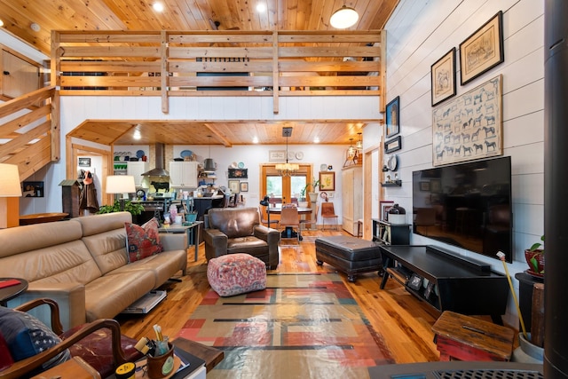 1720 Bratton Ln, Williamsport, TN 38487 - living room featuring wooden walls, a towering ceiling, wood ceiling, and hardwood / wood-style floors