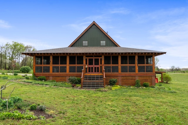 1720 Bratton Ln, Williamsport, TN 38487 - rear view of property featuring roof with shingles, board and batten siding, a sunroom, and a lawn