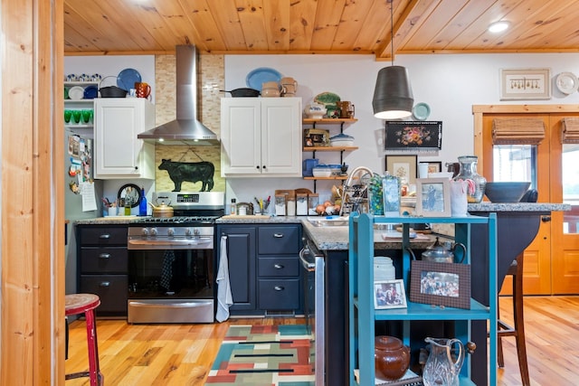 1720 Bratton Ln, Williamsport, TN 38487 - kitchen with wooden ceiling, wall chimney exhaust hood, stainless steel range with gas cooktop, and open shelves