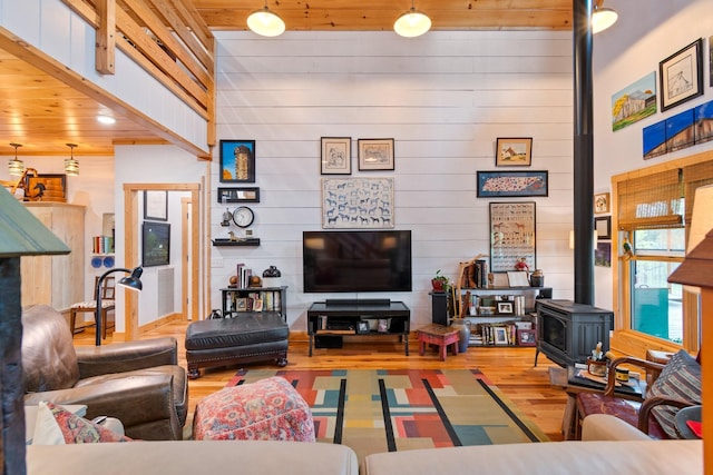 1720 Bratton Ln, Williamsport, TN 38487 - living room with wood finished floors, a wood stove, and visible vents