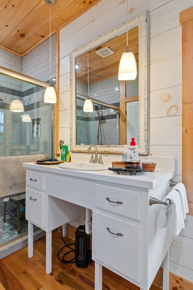 1720 Bratton Ln, Williamsport, TN 38487 - bathroom with wooden walls, wooden ceiling, vanity, and wood finished floors