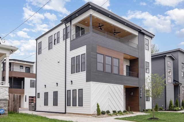 exterior space with cooling unit and ceiling fan