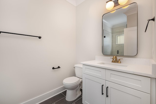 full bathroom with vanity, baseboards, tile patterned flooring, toilet, and a tile shower