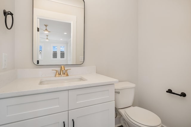 half bath with vanity and toilet
