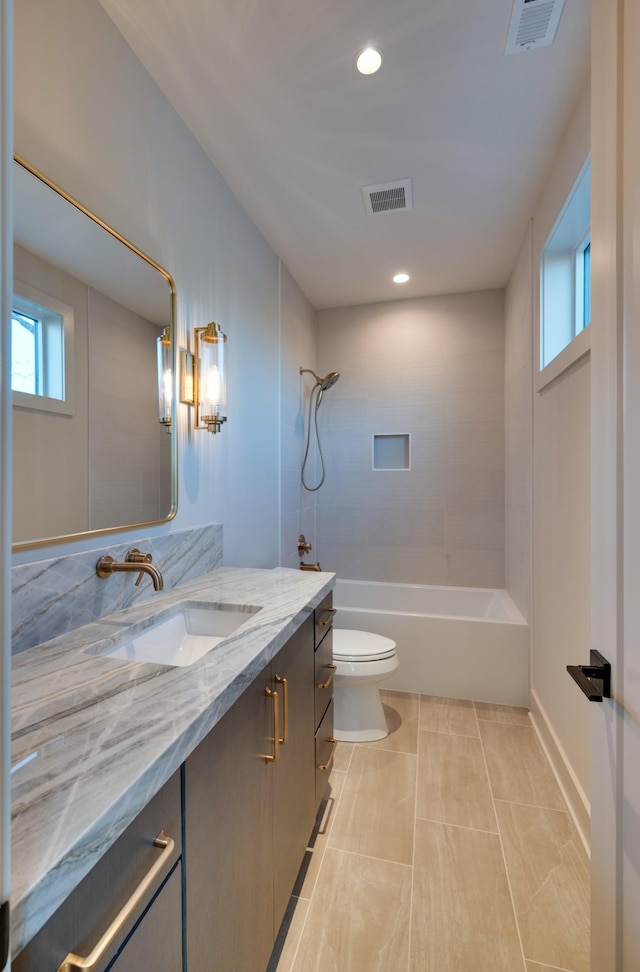 2108 12th Ave S, Nashville, TN 37204 - full bathroom featuring visible vents, toilet, vanity, and tile patterned flooring