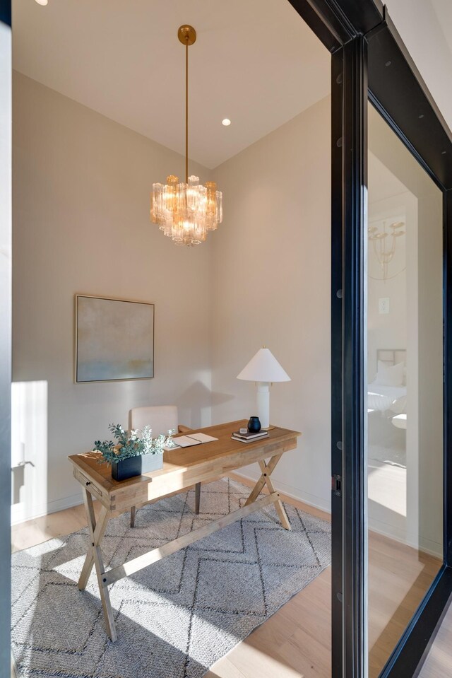 2108 12th Ave S, Nashville, TN 37204 - home office with a chandelier, baseboards, and wood finished floors