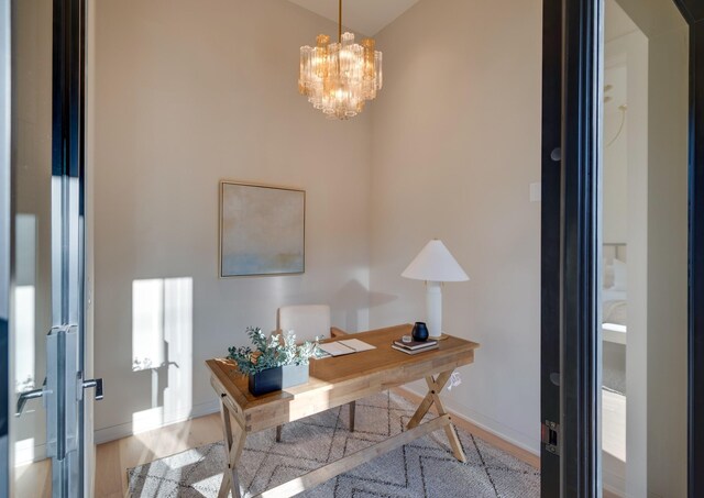 2108 12th Ave S, Nashville, TN 37204 - office space with wood finished floors, an inviting chandelier, and baseboards