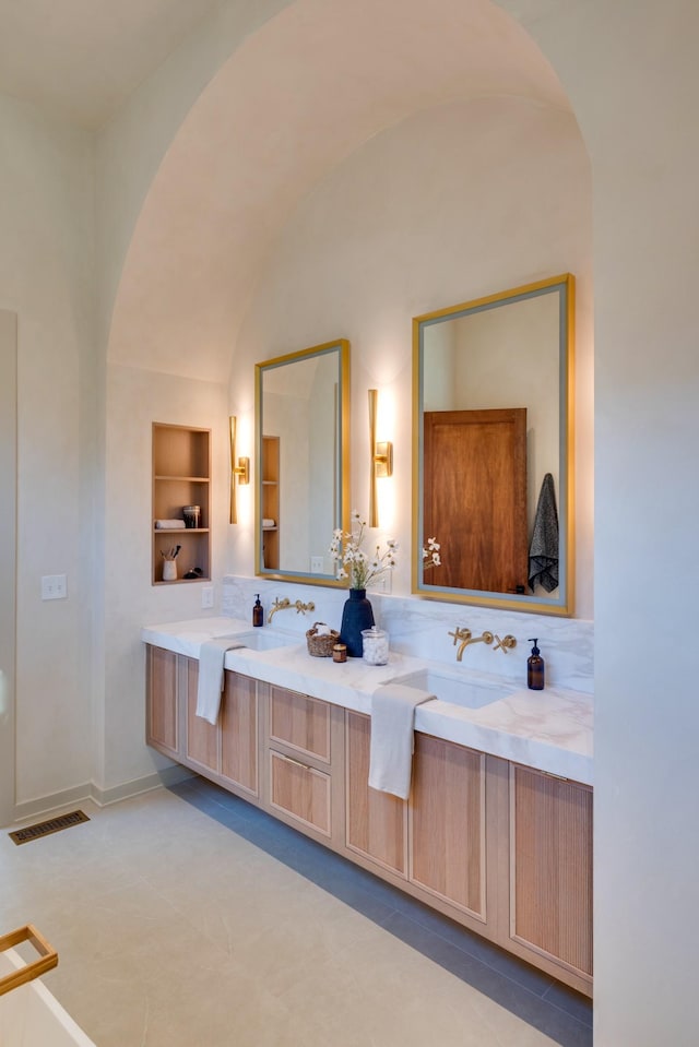 2108 12th Ave S, Nashville, TN 37204 - full bath featuring double vanity, visible vents, a sink, and built in features