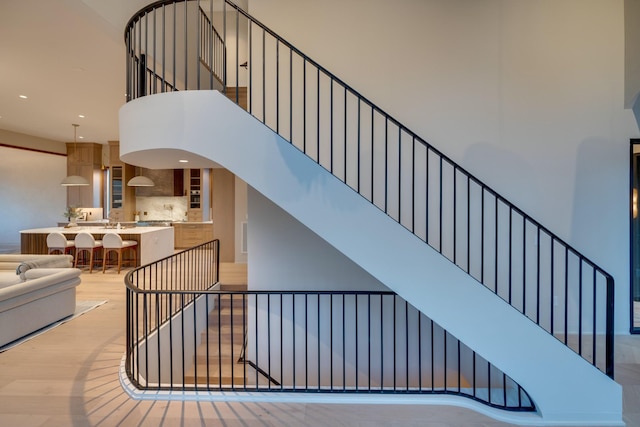 2108 12th Ave S, Nashville, TN 37204 - stairs featuring recessed lighting, a towering ceiling, and wood finished floors
